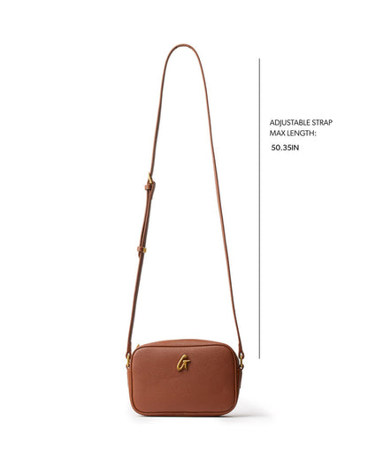 Brown mini pebble camera bag with an adjustable strap, perfect for stylish, everyday use. Ideal for affordable luxury.