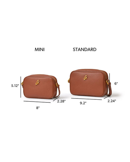 Brown mini pebble camera bag with gold logo, showcasing dimensions for mini and standard sizes, perfect for stylish storage.