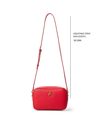 Red mini pebble camera bag with an adjustable strap, perfect for stylish and affordable luxury.