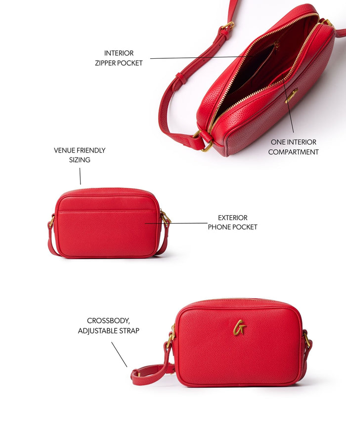Red mini pebble camera bag featuring an exterior phone pocket, one interior compartment, and an adjustable crossbody strap.