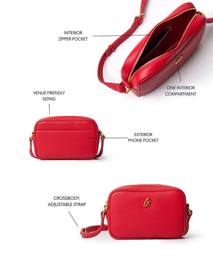 Red mini pebble camera bag featuring an exterior phone pocket, one interior compartment, and an adjustable crossbody strap.