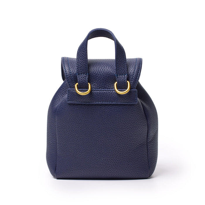 Mini navy pebble crossbody backpack with top handle, gold hardware, and textured pebbled leather design.