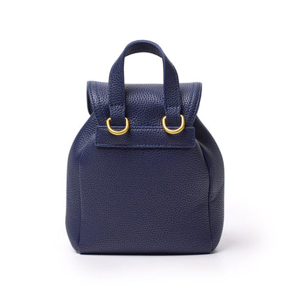 Mini navy pebble crossbody backpack with top handle, gold hardware, and textured pebbled leather design.