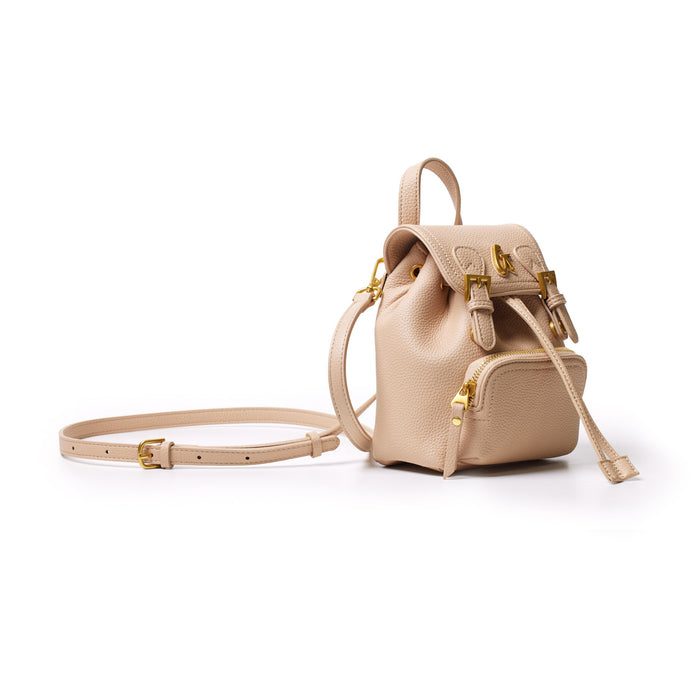 Mini pebble crossbody backpack in nude with gold hardware, adjustable strap, and front zip pocket, stylish and compact.