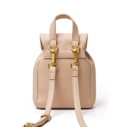 Mini pebble crossbody backpack in nude color with gold hardware, adjustable strap, and textured leather finish.