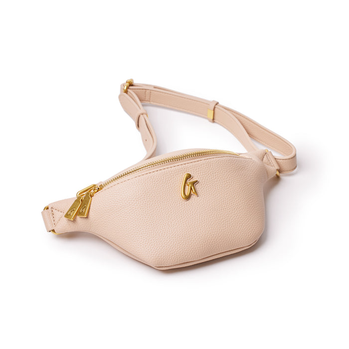 Mini pebble nude fanny pack with gold zipper and logo, adjustable strap, and textured leather finish.