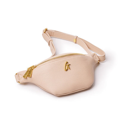 Mini pebble nude fanny pack with gold zipper and logo, adjustable strap, and textured leather finish.