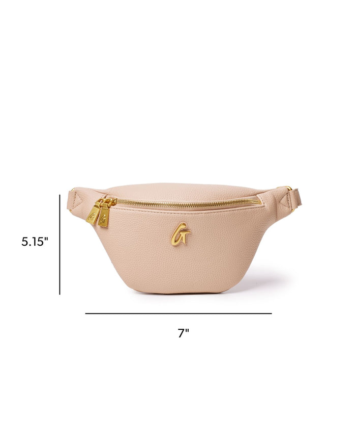 Nude mini pebble fanny pack with gold zipper and logo, measuring 5.15 inches by 7 inches, perfect for stylish convenience.