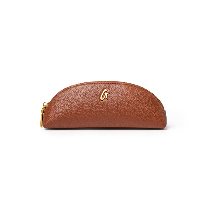 Brown pebble pencil pouch with a sleek design and gold logo, perfect for organizing writing tools and accessories.