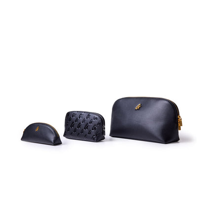 Three stylish black pencil pouches of varying sizes, featuring a sleek design and gold accents.