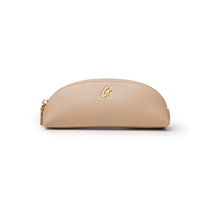 Nude pebble pencil pouch with a gold zipper and logo, perfect for stylish organization of writing tools.