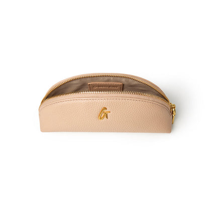 Nude pebble pencil pouch with a gold zipper and logo, perfect for stylish organization of writing tools.