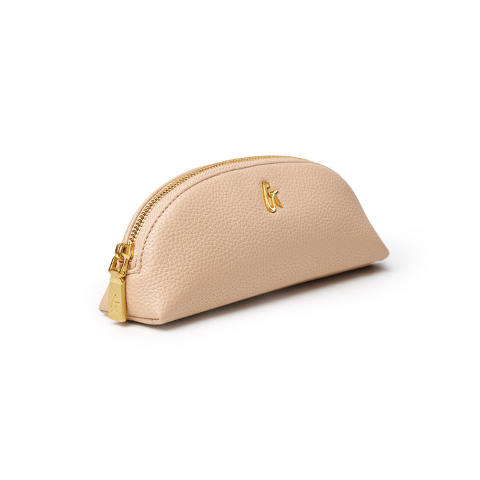 Nude pebble pencil pouch with a gold zipper and logo, perfect for stylish organization of pens and accessories.