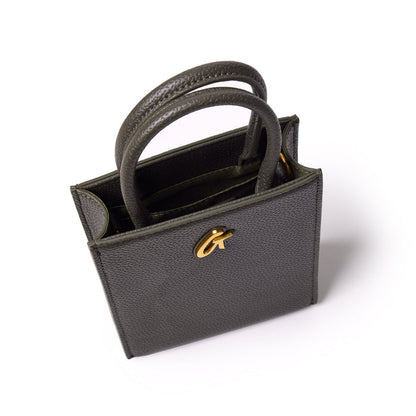 Mini pebble tote bag in olive green with textured leather, dual handles, and gold-tone logo detail on the front.