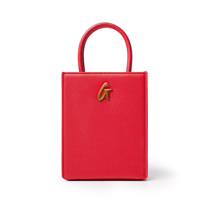 Red mini pebble tote bag with a gold "G" logo, featuring textured leather and a small, structured design.