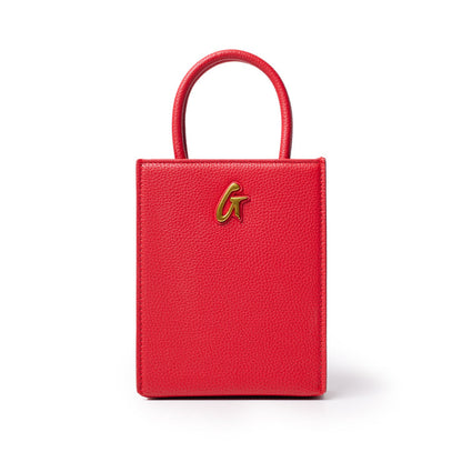 Red mini pebble tote bag with a gold "G" logo, featuring textured leather and a small, structured design.