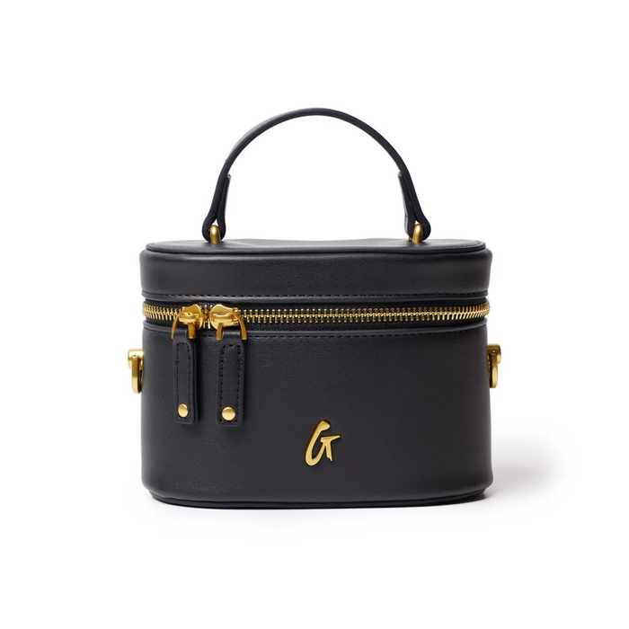 Mini smooth gold vanity bag in black with a top handle and gold zipper accents, perfect for stylish organization.