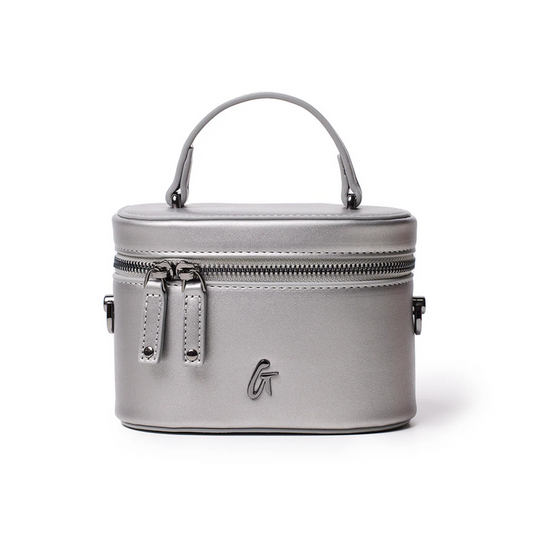 Mini smooth gunmetal vanity bag in platinum with a sleek design and top handle, perfect for stylish organization.