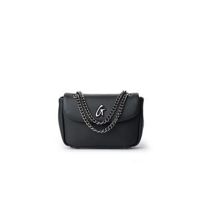 Mini standard flap bag in black with a sleek design and a silver chain strap, perfect for stylish outings.