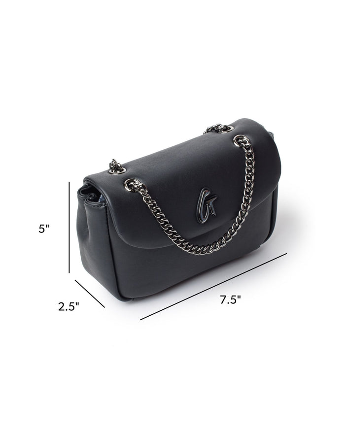 Mini standard flap bag in black with a sleek design, featuring a chain strap and logo detail. Dimensions: 5x2.5x7.5 inches.
