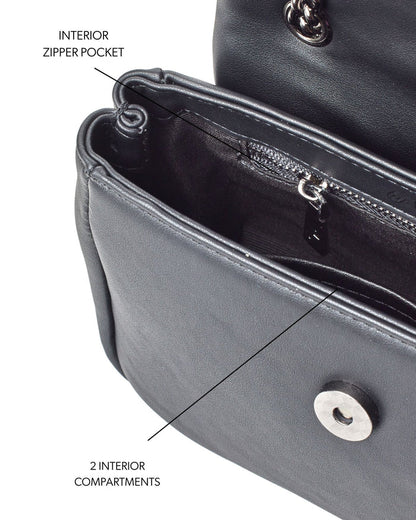 Mini Standard Flap Bag in black featuring an interior zipper pocket and two compartments for organized storage.