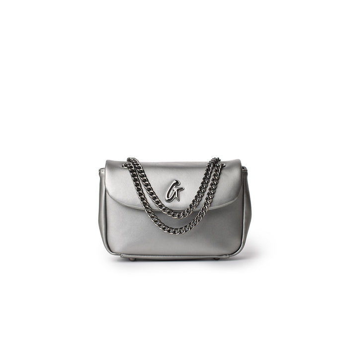 Mini platinum-colored flap bag with chain strap and metallic logo detail, stylish and compact accessory.