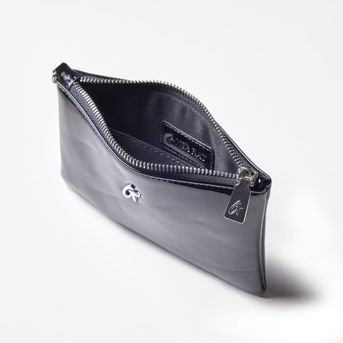 Mini silver wristlet with a mirror black finish, featuring a zip closure and interior pocket, stylish and compact.
