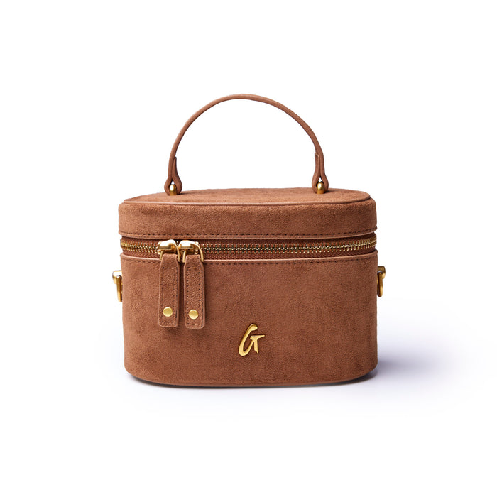 Mini suede vanity bag in brown with a top handle and gold zipper accents, perfect for stylish organization.