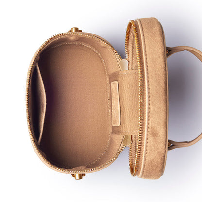 Tan mini suede vanity bag with a zip closure and spacious interior, perfect for organizing cosmetics and accessories.
