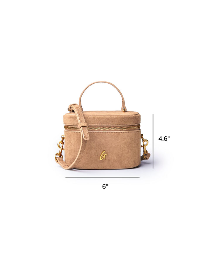 Tan mini suede vanity bag with a top handle and gold accents, measuring 6 inches wide and 4.6 inches tall.