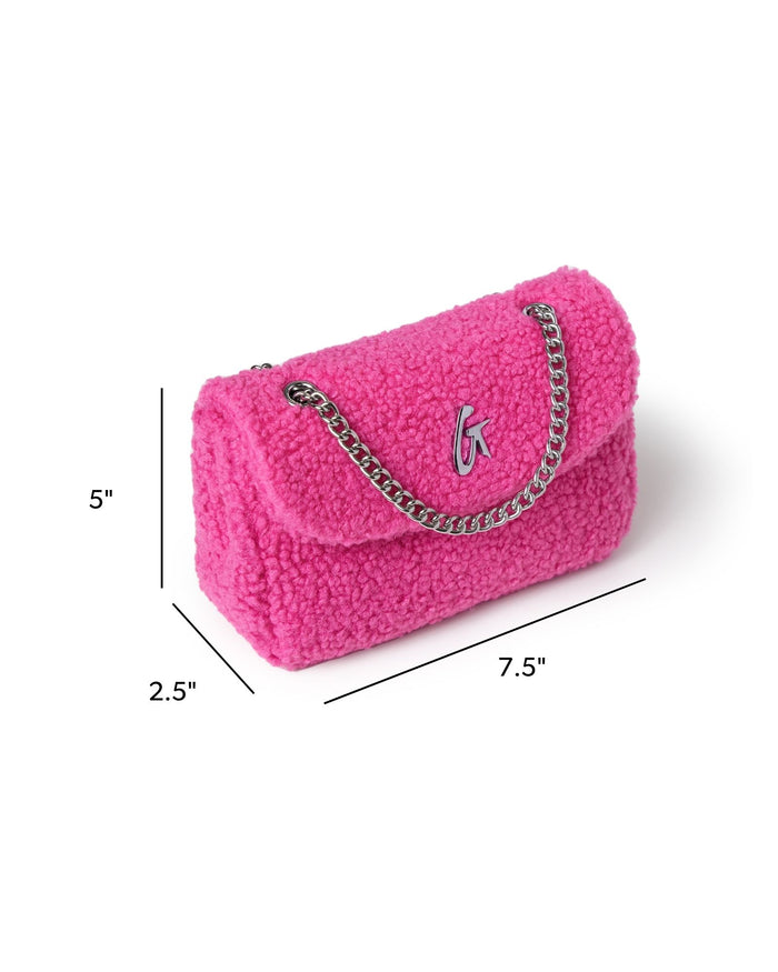 Hot pink mini teddy flap bag with a silver chain strap, featuring a plush texture and logo detail. Ideal for stylish outings.