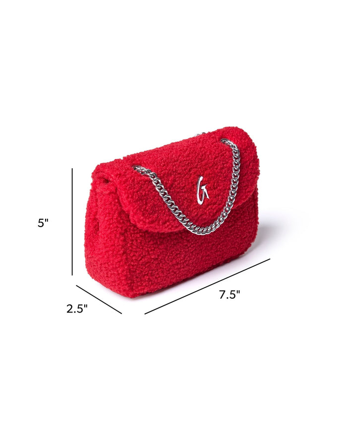 Mini Teddy Flap Bag in red with a plush texture, featuring a silver chain strap and logo detail. Perfect for stylish outings.