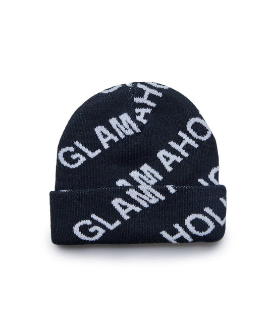 Black monogram beanie with white "GIVENCHY" logo pattern, folded brim, stylish winter accessory.