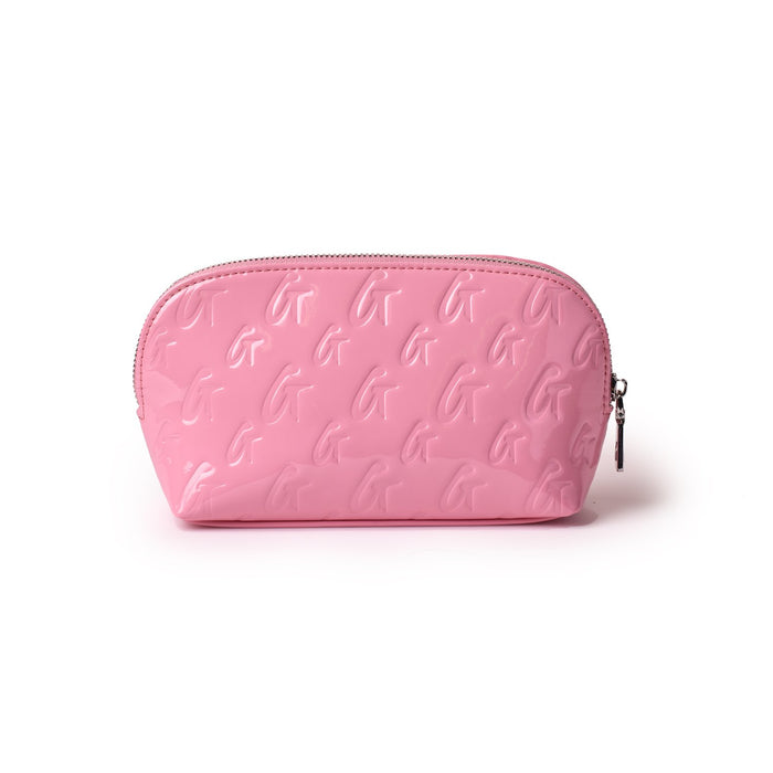 Pink monogram cosmetic pouch with a glossy finish, embossed with a repeating "G" pattern and a silver zipper.