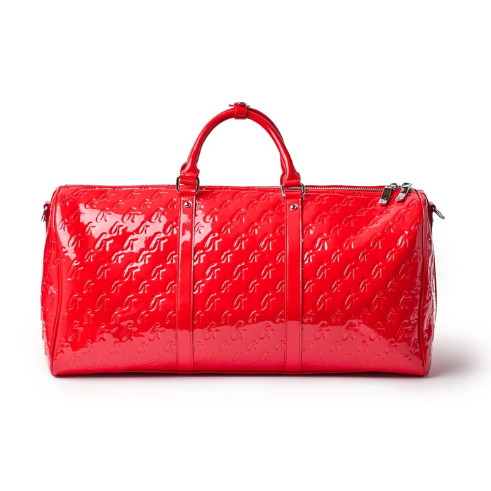 Shiny mirror red monogram duffle bag with dual handles and zip closure, perfect for stylish travel.