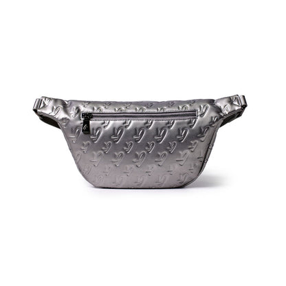 Silver monogram-patterned platinum fanny pack with a front zipper pocket, made of shiny material, designed for casual wear.