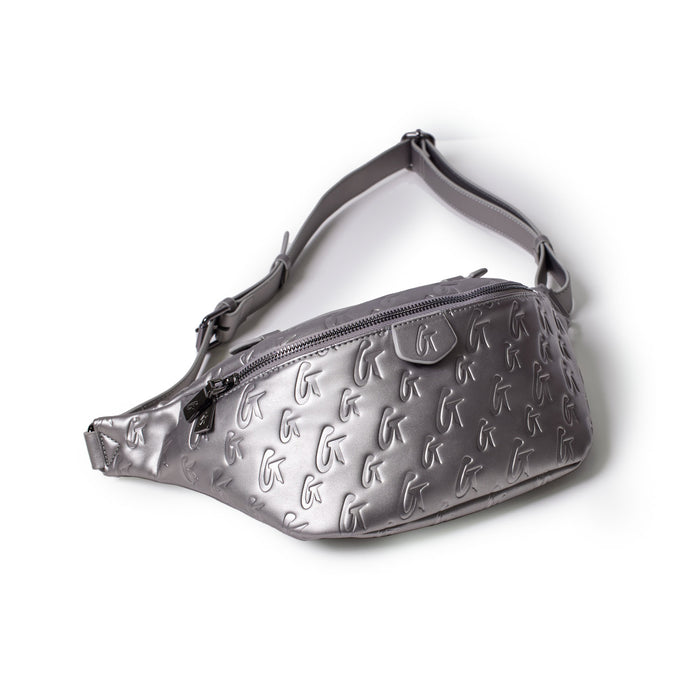 Silver monogrammed fanny pack with embossed logo pattern, adjustable strap, and zippered main compartment.