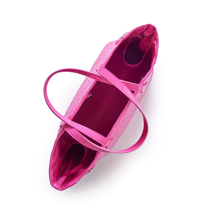 Hot pink monogram glam tote with wristlet, featuring spacious interior and stylish design for luxury on a budget.