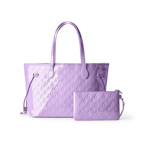Lavender monogram tote bag with matching wristlet, featuring a stylish embossed design and spacious interior.