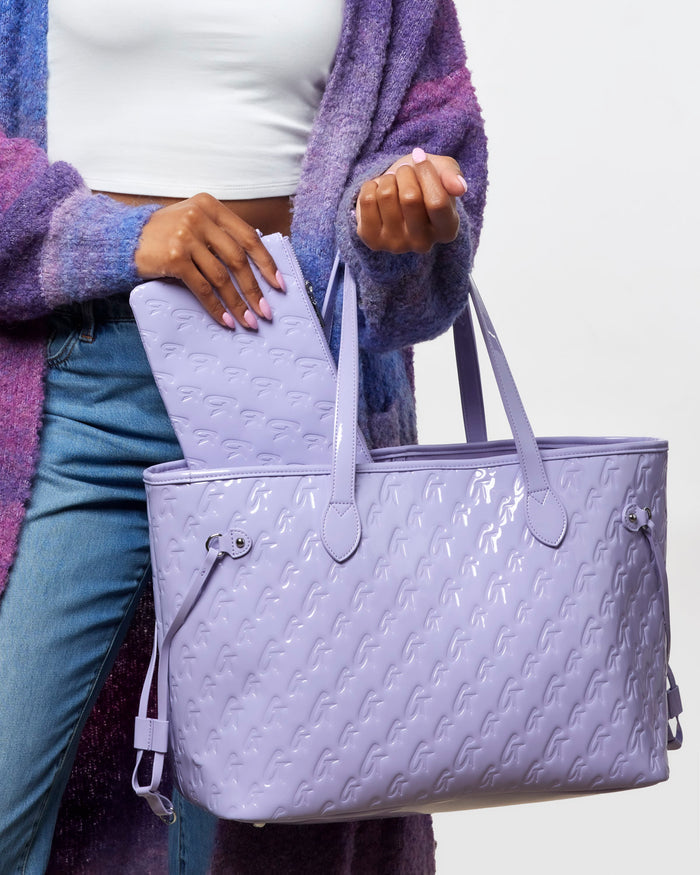 Lavender monogram tote bag with matching wristlet, showcasing a stylish and functional design for everyday use.