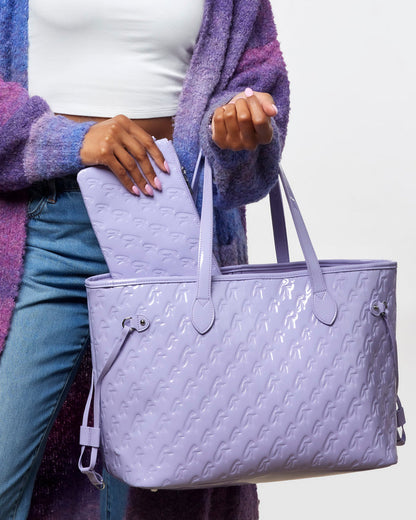 Lavender monogram tote bag with matching wristlet, showcasing a stylish and functional design for everyday use.