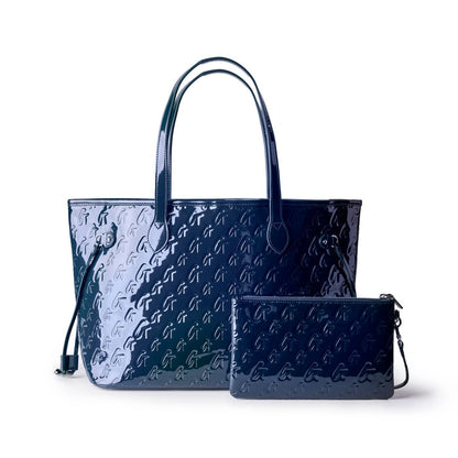 Navy monogram tote bag with matching wristlet, featuring a glossy finish and stylish design for everyday use.