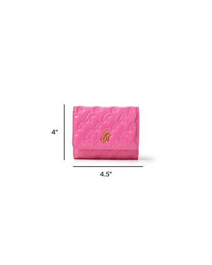 Hot pink compact wallet with embossed monogram design and gold logo, measuring 4 by 4.5 inches.