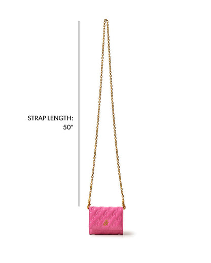 Hot pink compact wallet on a chain with a gold monogram design and a 50-inch strap for stylish versatility.