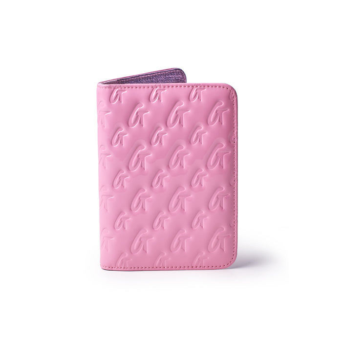 Mirror pink monogram passport holder with embossed G pattern, sleek design, and reflective interior.