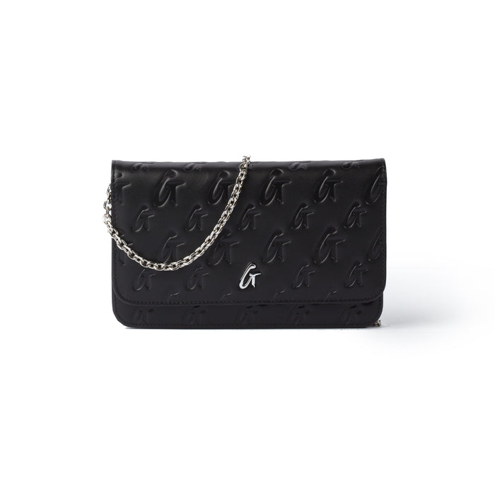 Black Monogram Silver WOC handbag with embossed logo pattern, silver chain strap, and metal logo detail.