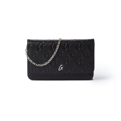 Black Monogram Silver WOC handbag with embossed logo pattern, silver chain strap, and metal logo detail.