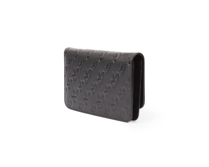 Black Monogram Silver WOC wallet with embossed logo pattern, compact design, and sleek finish.