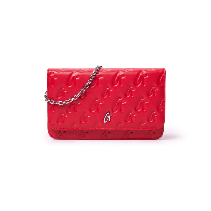 Red Monogram Silver WOC clutch with embossed "G" pattern and a silver chain strap.