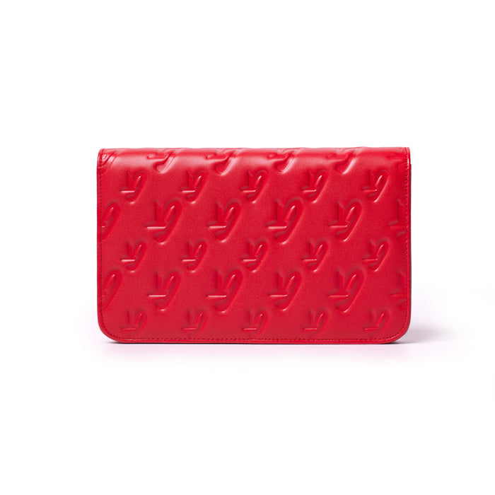 Red Monogram Silver WOC wallet with embossed logo pattern on smooth leather surface.